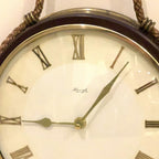 Kienzle Rope Hung Wall Clock: 1960s Brass Bezel, Roman Numerals, White Dial