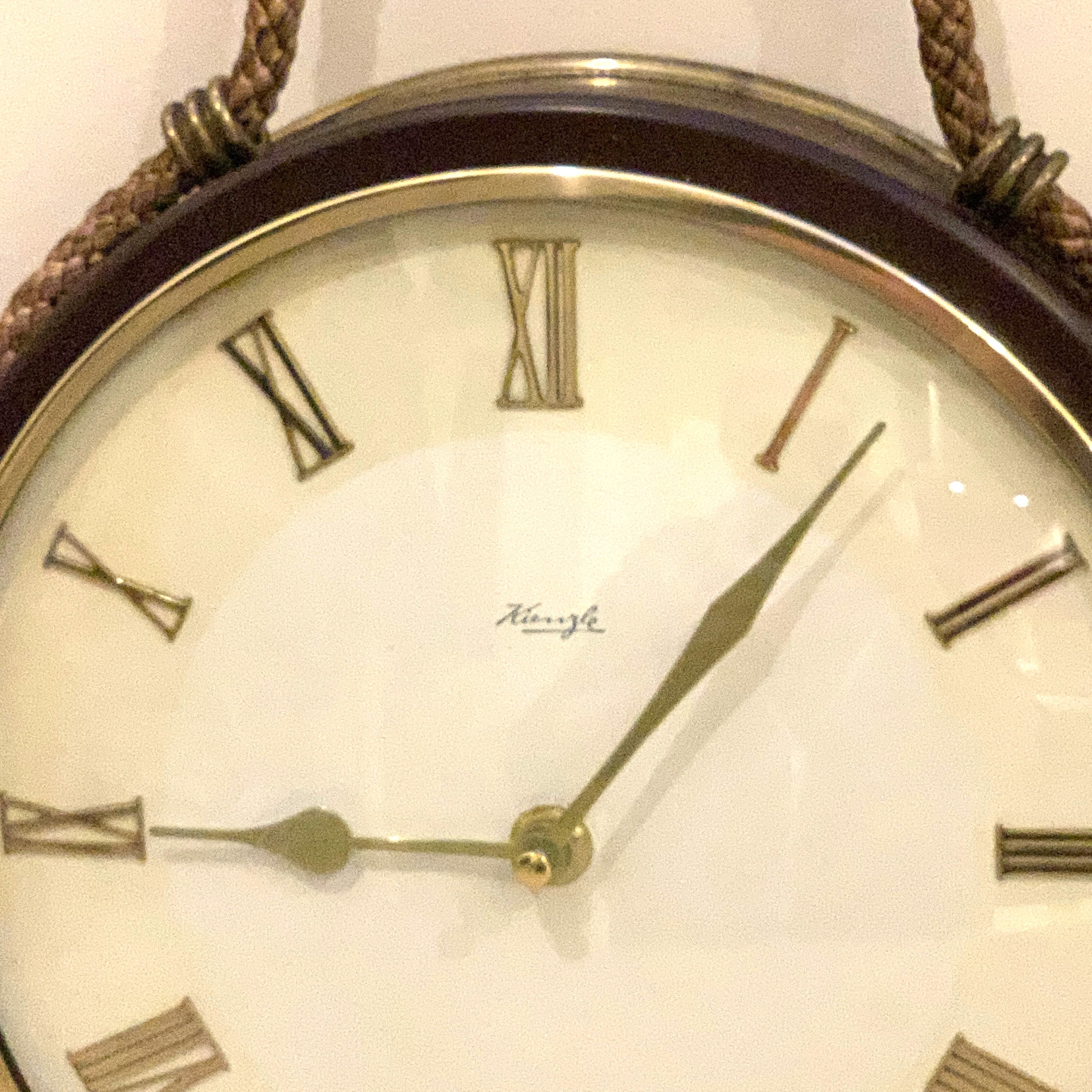 Kienzle Rope Hung Wall Clock: 1960s Brass Bezel, Roman Numerals, White Dial