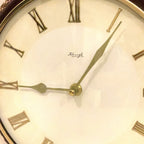 Kienzle Rope Hung Wall Clock: 1960s Brass Bezel, Roman Numerals, White Dial