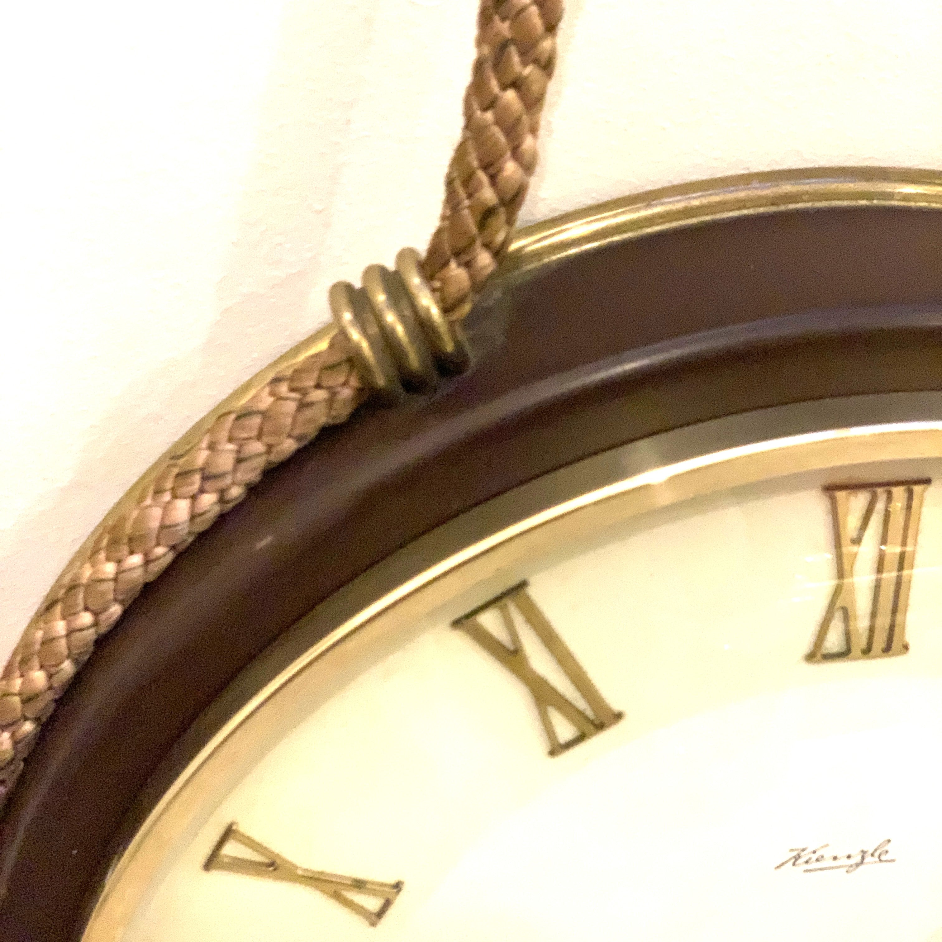 Kienzle Rope Hung Wall Clock: 1960s Brass Bezel, Roman Numerals, White Dial