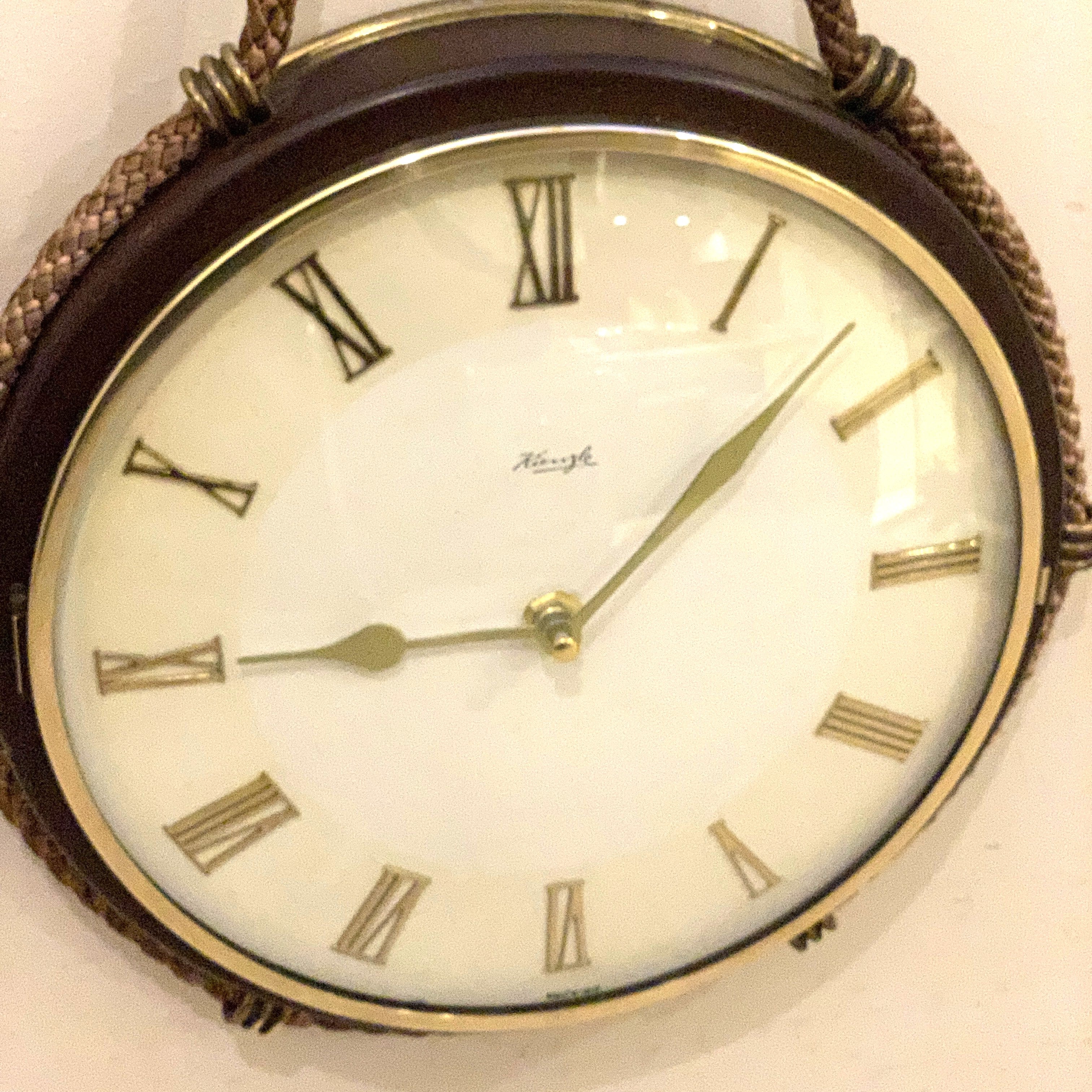 Kienzle Rope Hung Wall Clock: 1960s Brass Bezel, Roman Numerals, White Dial