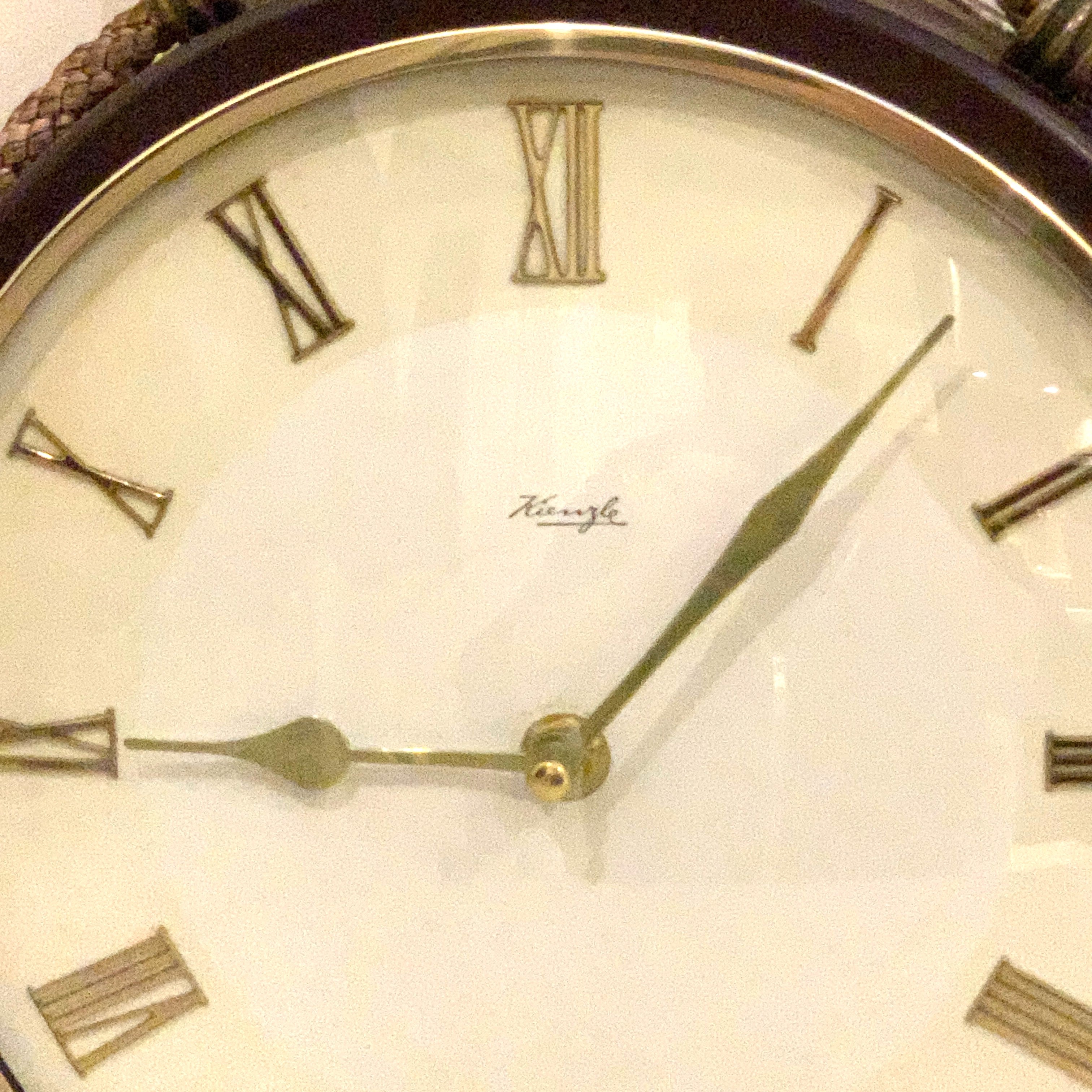 Kienzle Rope Hung Wall Clock: 1960s Brass Bezel, Roman Numerals, White Dial