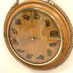 Kienzle Zodiac Wall Clock: Rope Hung Wooden Case, Brass Symbols, Mid Century 1960s Quartz