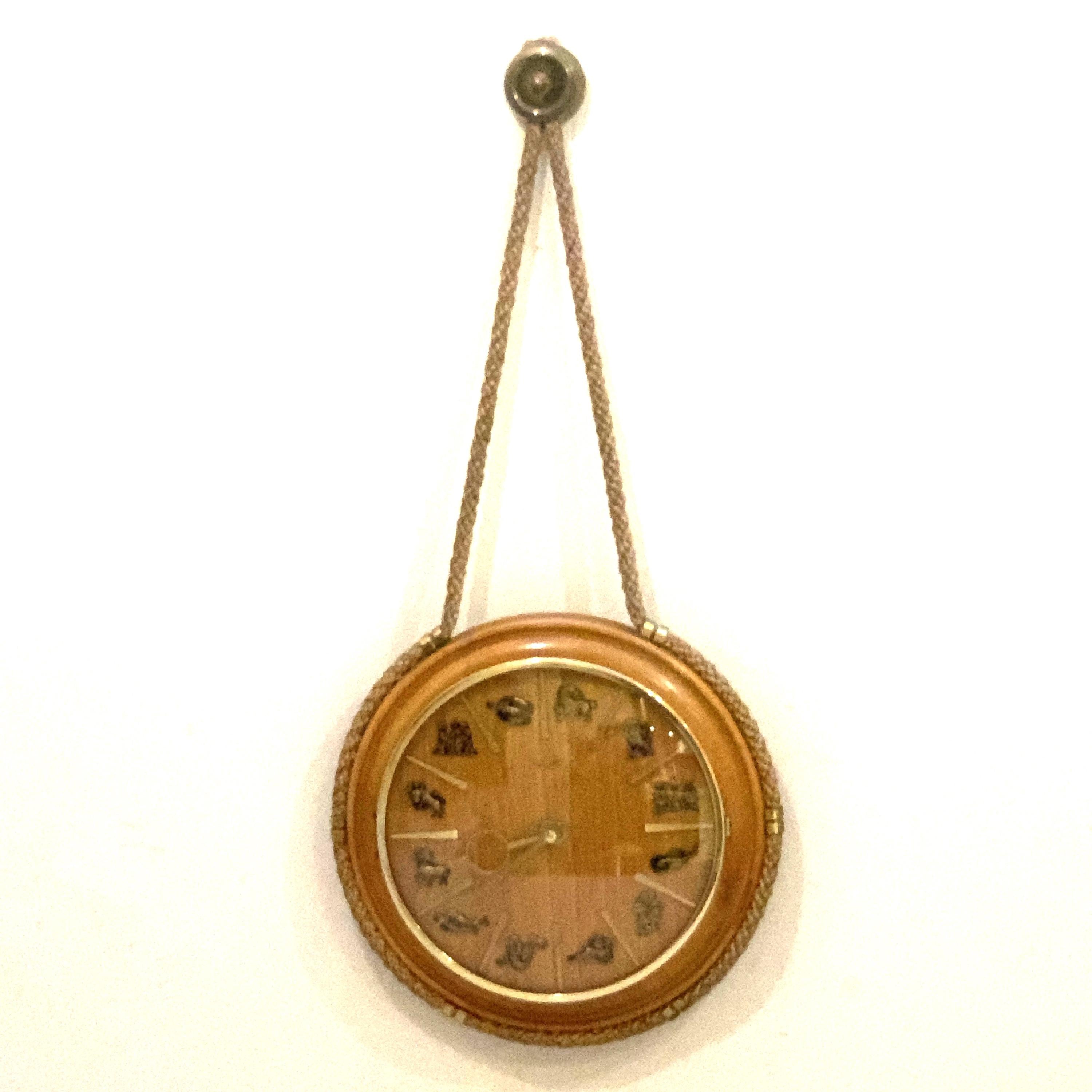 Kienzle Zodiac Wall Clock: Rope Hung Wooden Case, Brass Symbols, Mid Century 1960s Quartz