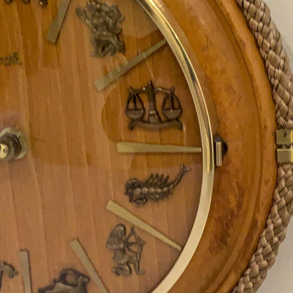 Kienzle Zodiac Wall Clock: Rope Hung Wooden Case, Brass Symbols, Mid Century 1960s Quartz