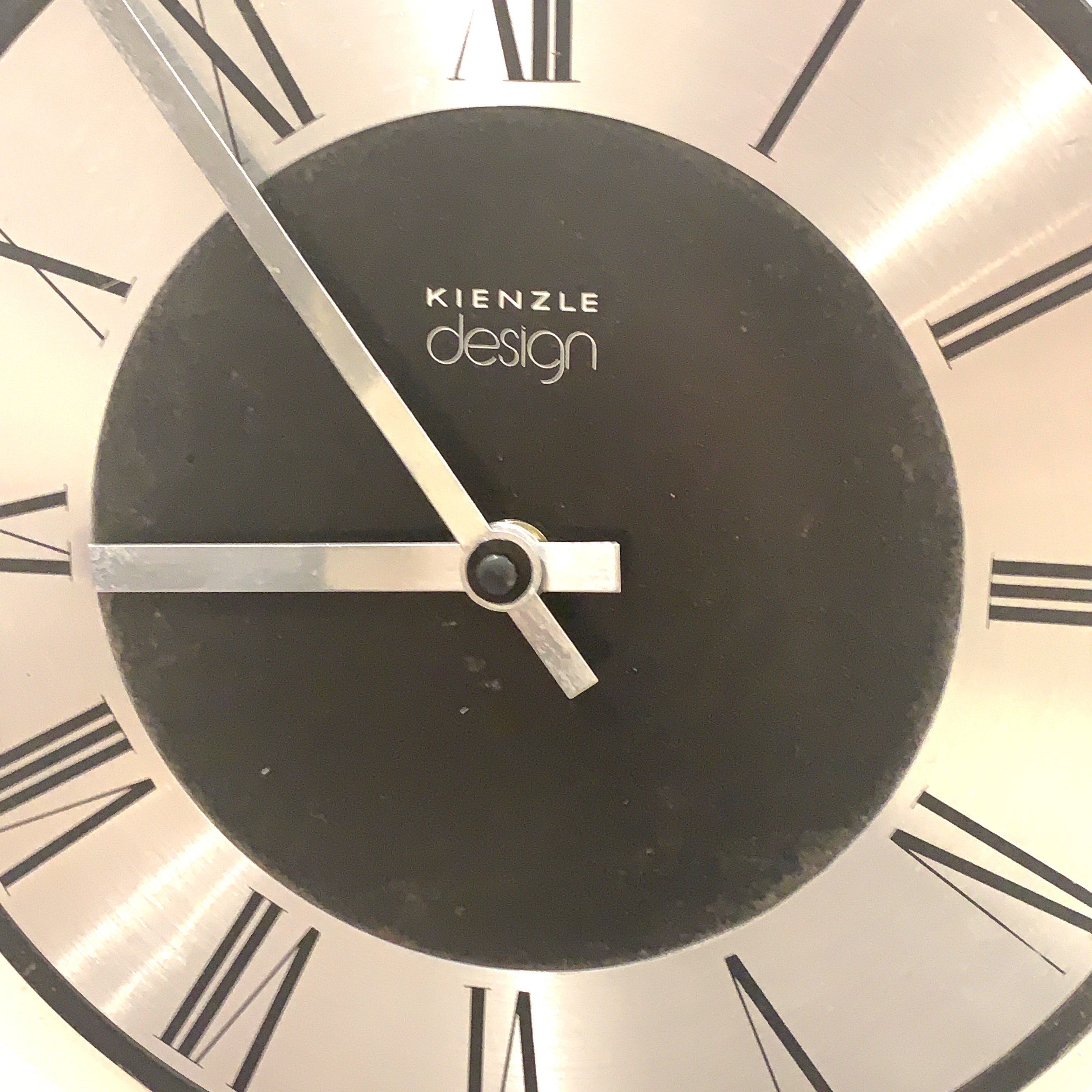 Kienzle Design Wall Clock Germany Brushed Aluminium Black Dial Roman Numerals 1970s Quartz